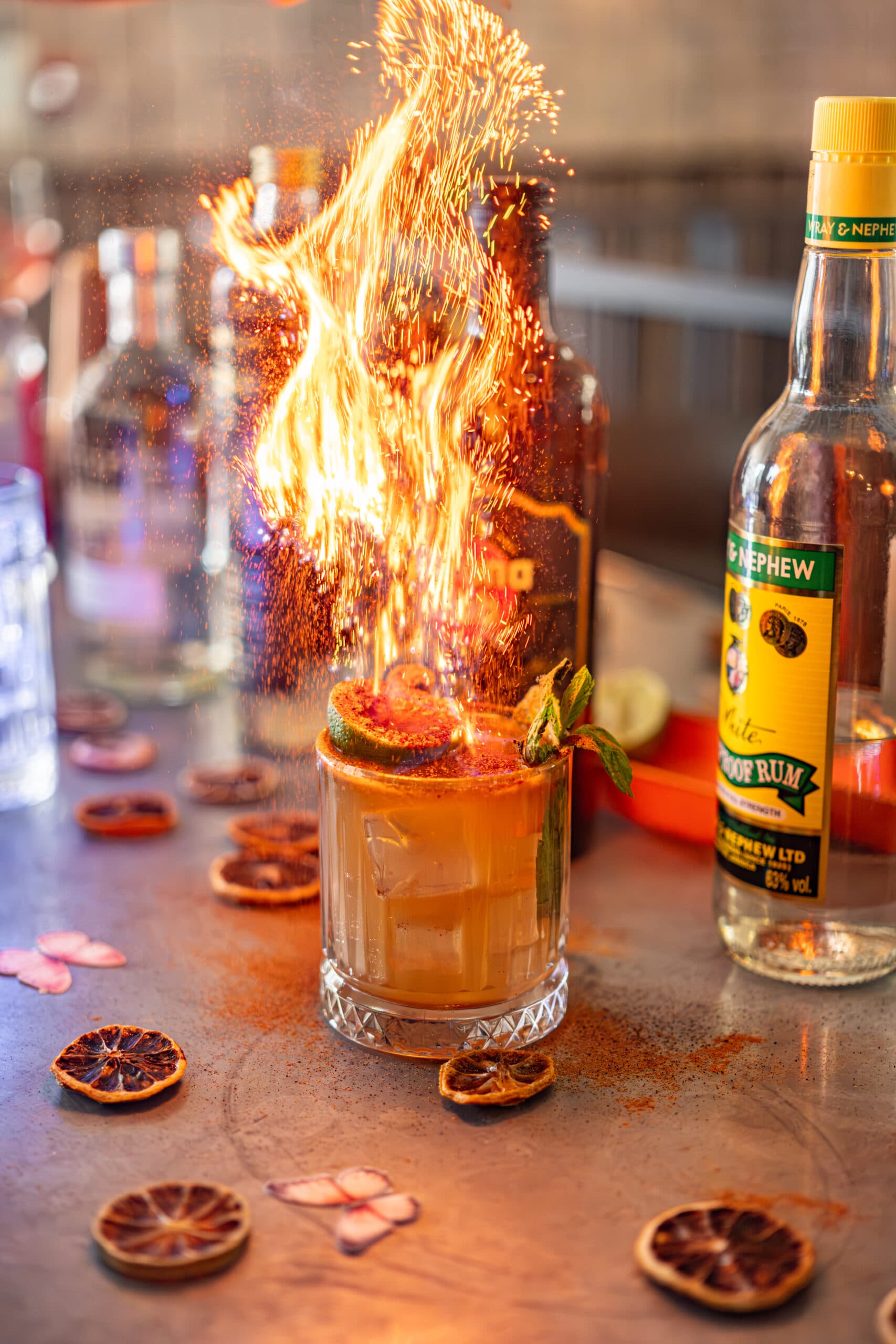 Flaming cocktail with rum at The Refinery, London
