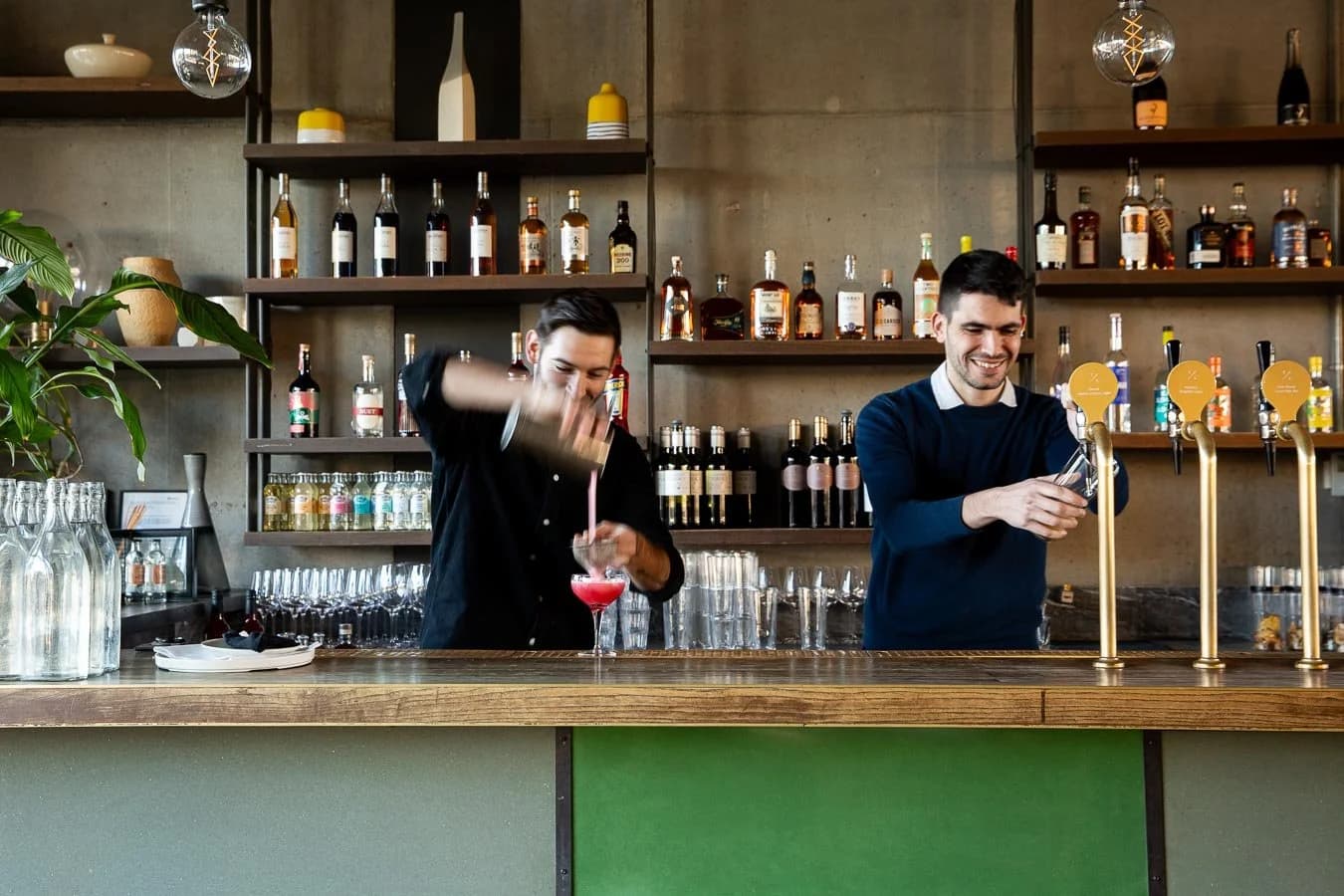 Bar area with bartenders at The Lighterman, London