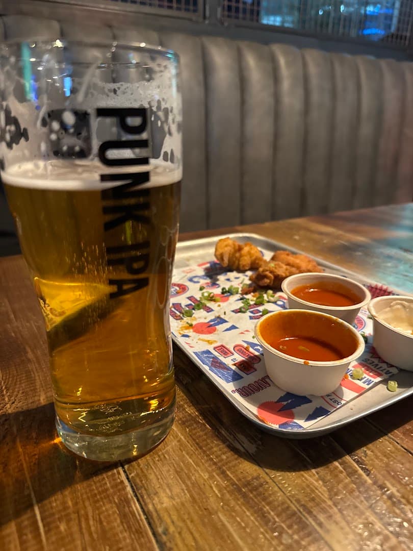 Pint and chicken wings platter at BrewDog Canary Wharf, London