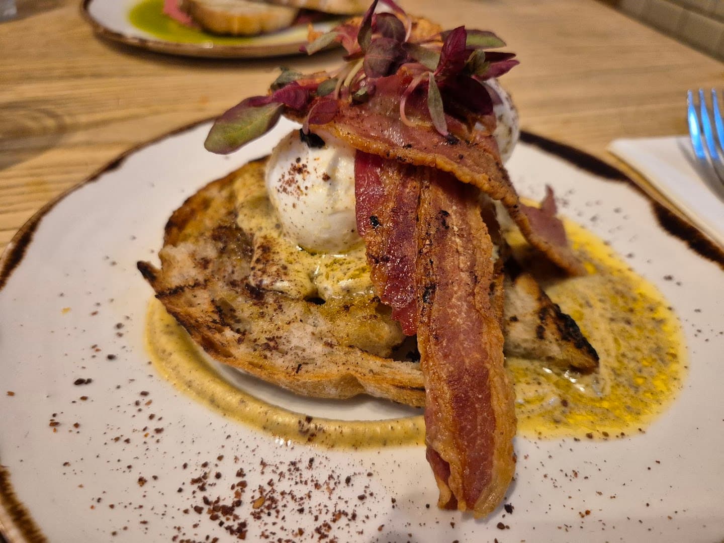 Poached egg bacon toast breakfast at Brother Marcus Angel, London