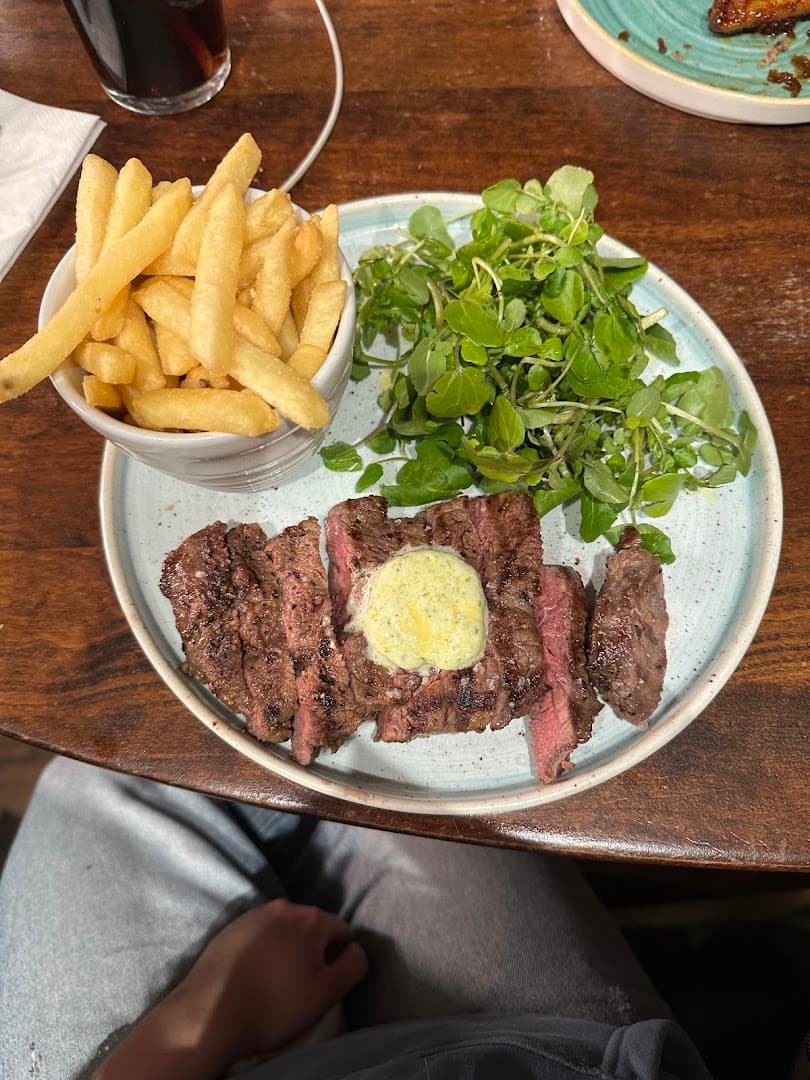 Steak frites with herb butter at Bull Highgate, London