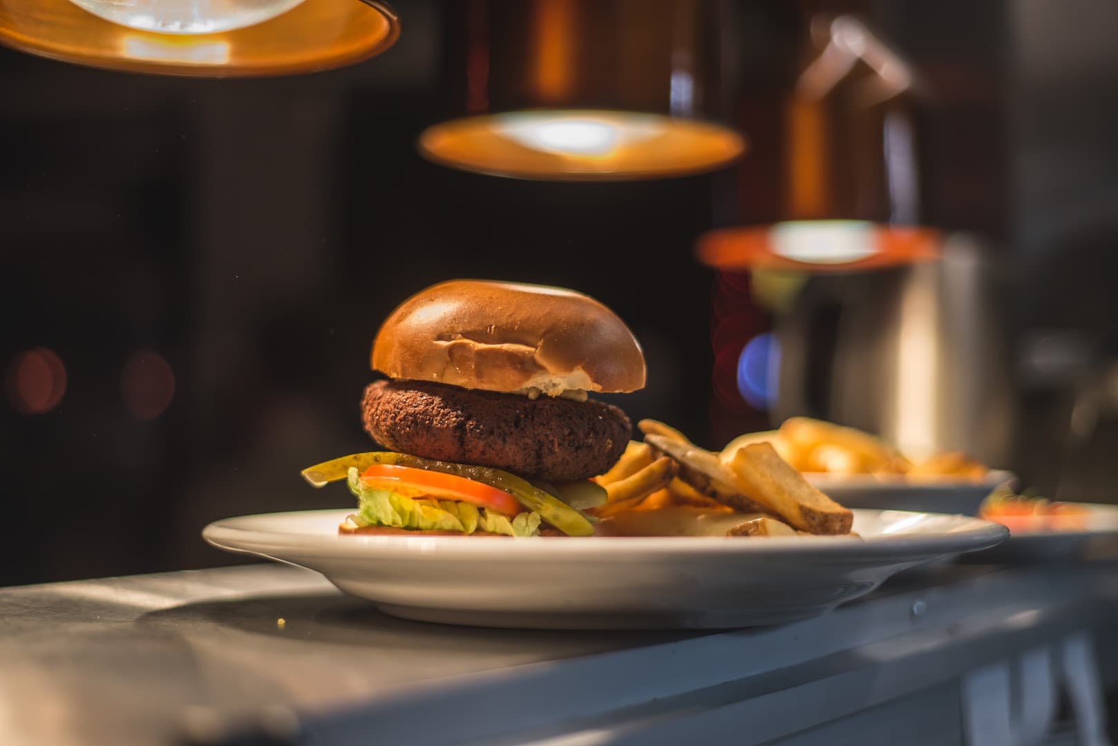Gourmet burger with chips at Pub On The Park, London