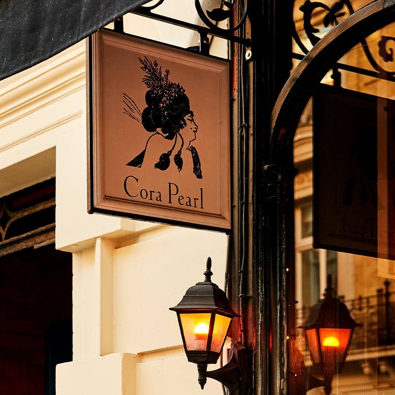 Entrance signage at Cora Pearl, London