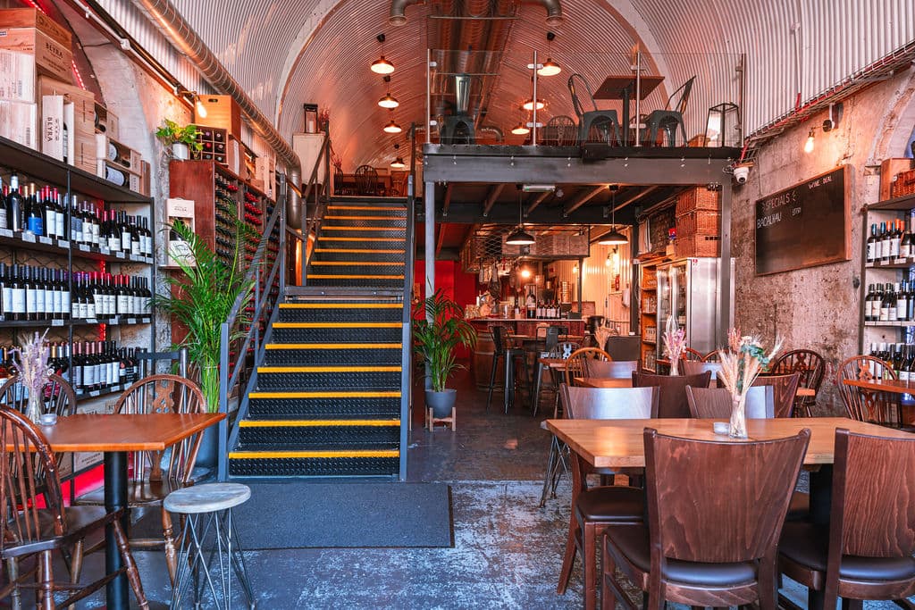 Multi-level industrial dining space at Pedro's Wine Bar, London