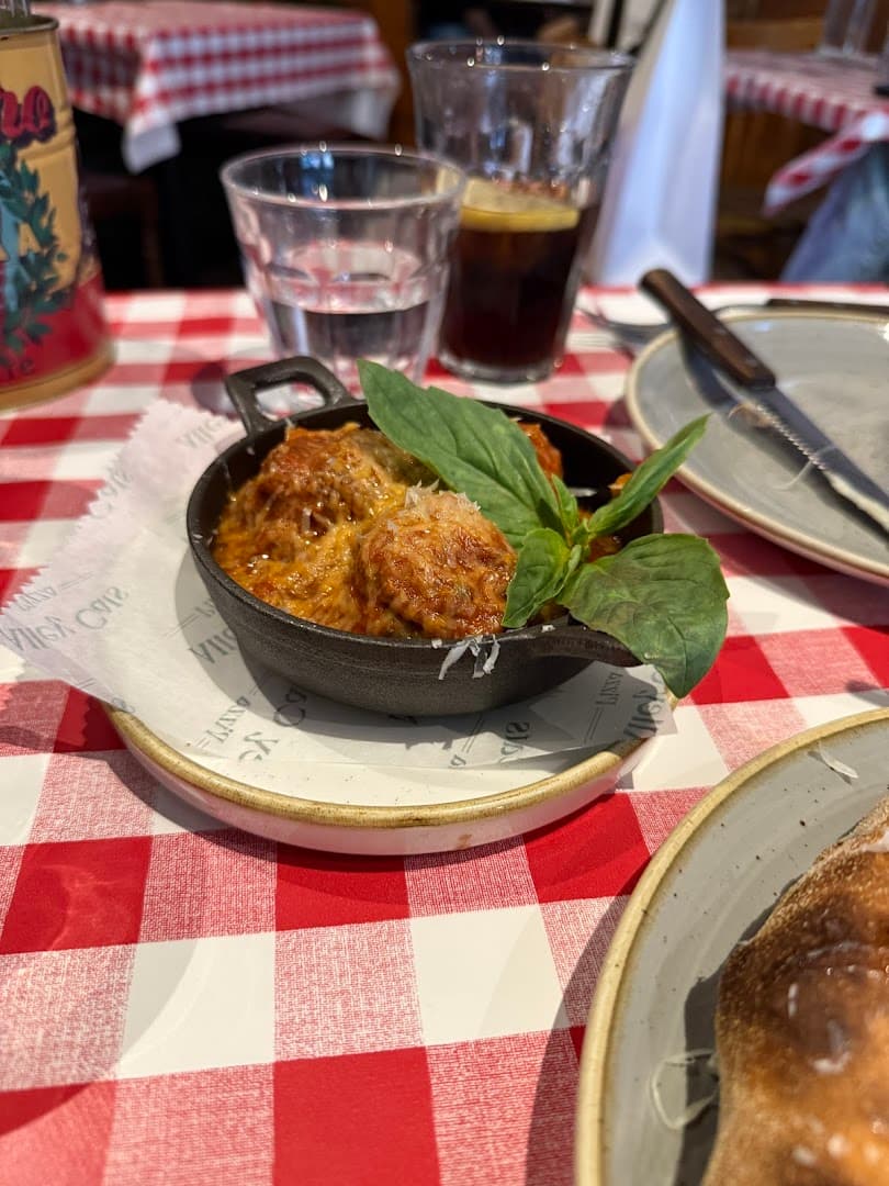 Baked pasta dish in skillet at Alley Cats Pizza, London