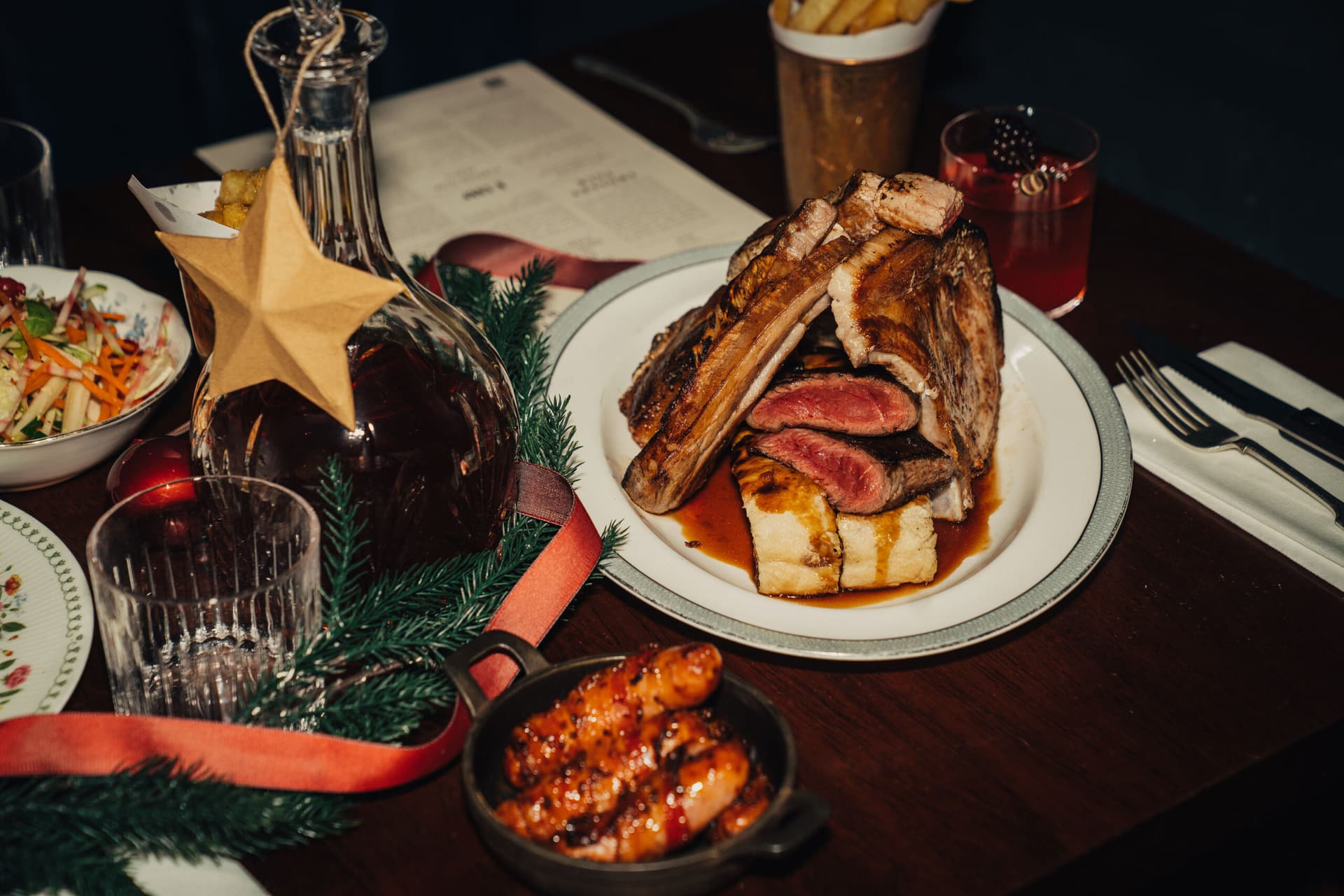 Roasted meat platter with festive decorations at Blacklock Canary Wharf, London