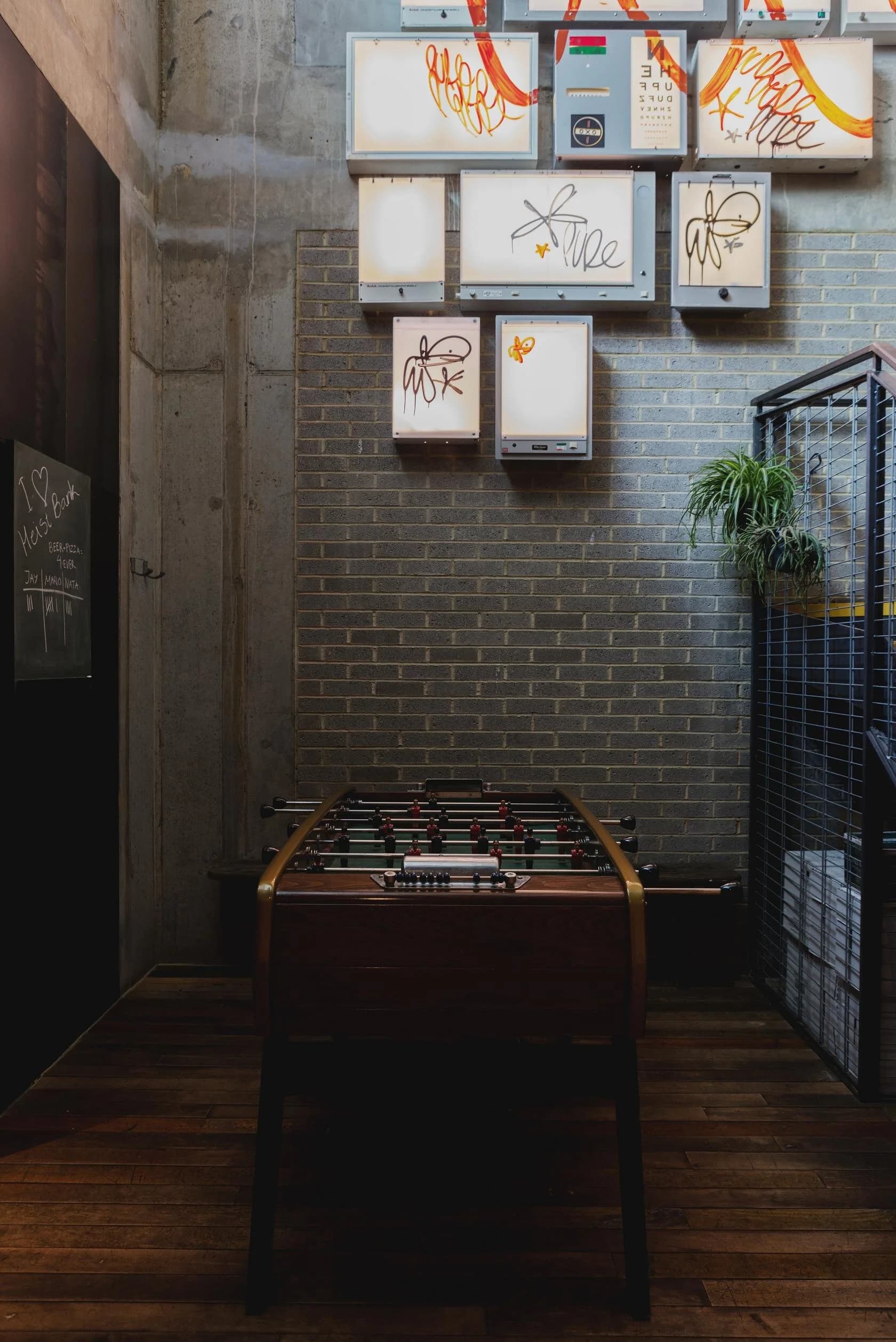 Games area with foosball table at Heist Bank, London