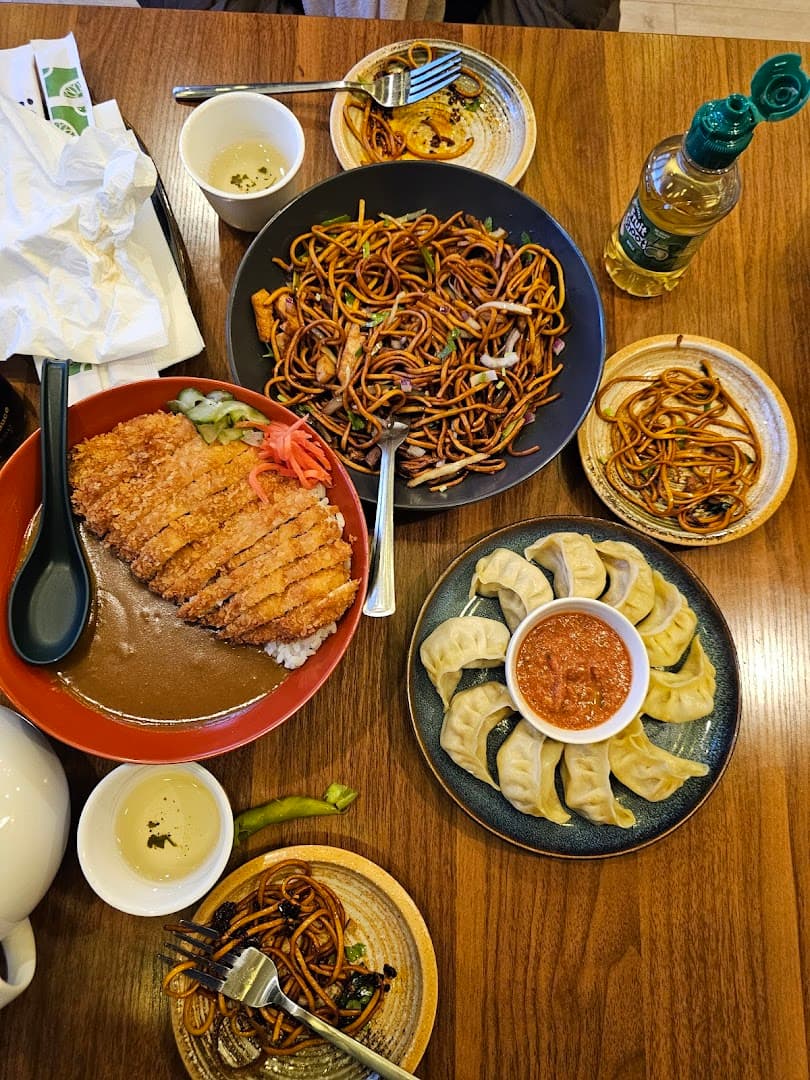 Asian fusion meal spread at Rewa Sushi And Momo, London