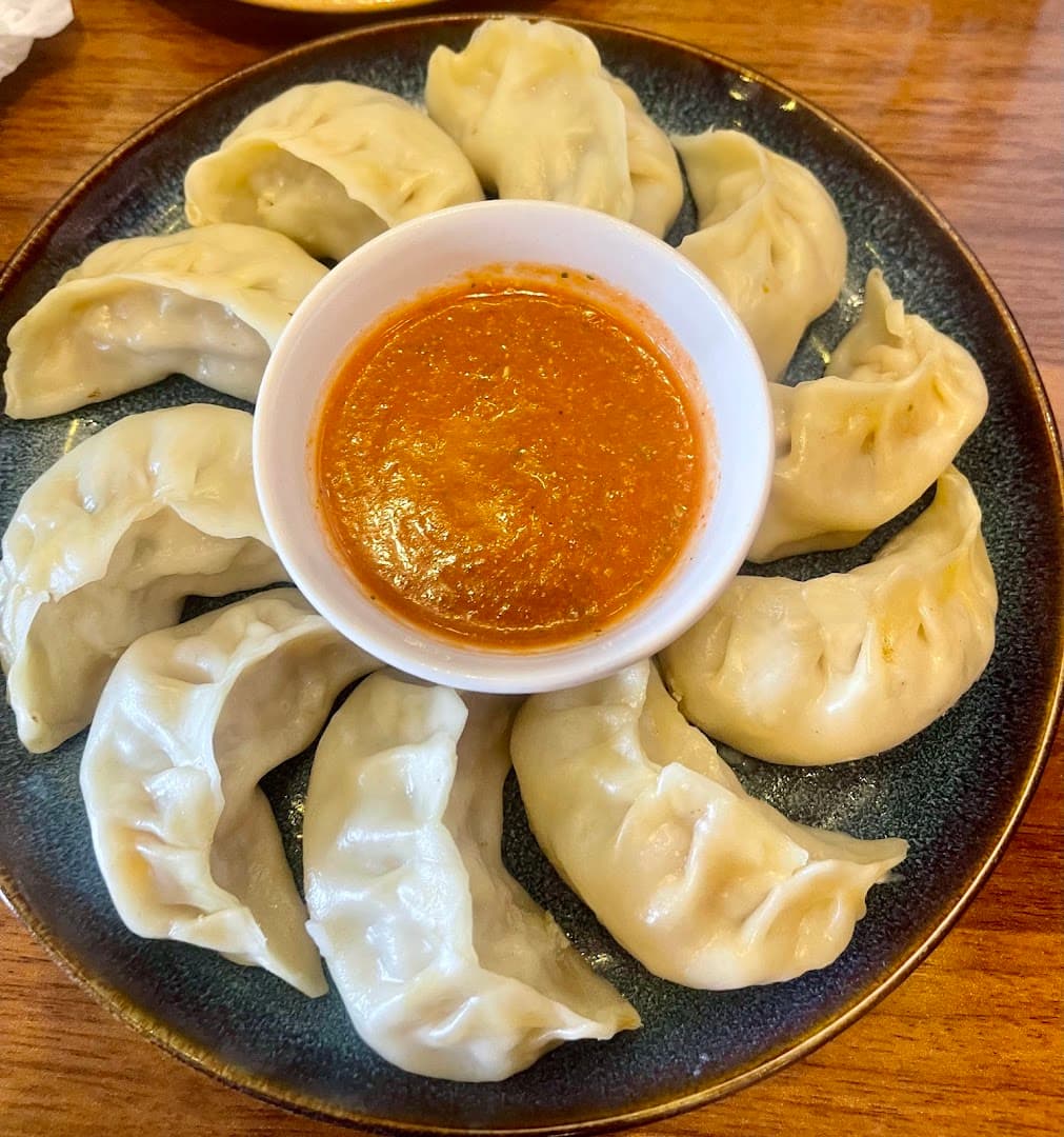 Steamed momos with sauce at Rewa Sushi And Momo, London