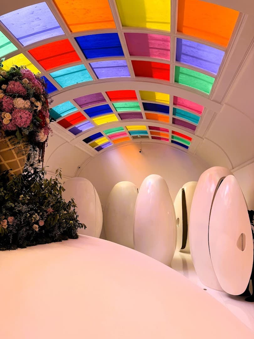 Gallery room with vibrant stained glass ceiling at sketch, London