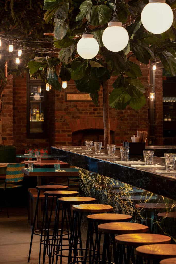 Bar area with globe lighting at El Pastor King's Cross, London