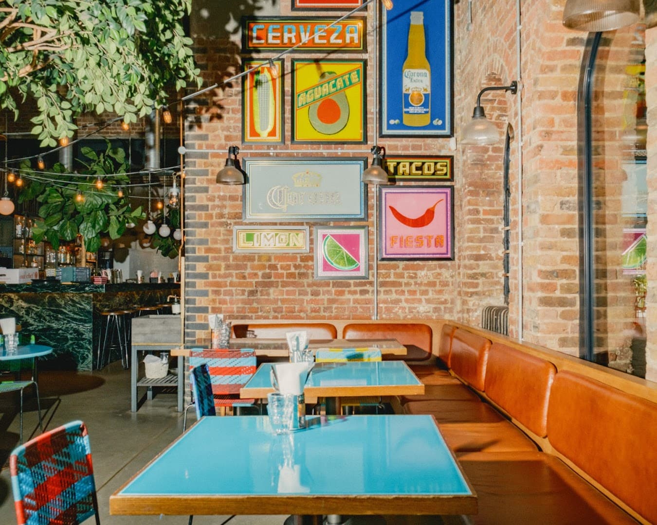 Vibrant dining area with Mexican artwork at El Pastor King's Cross, London