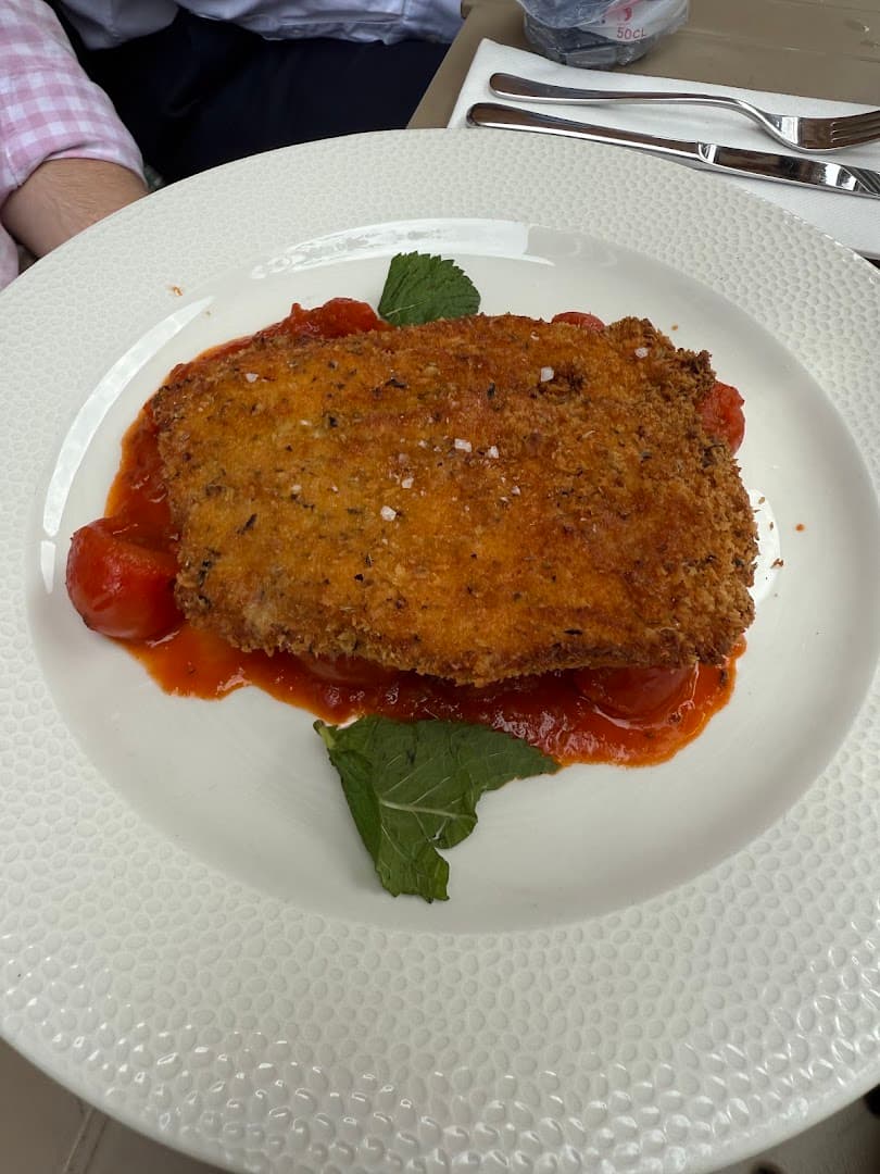 Breaded chicken with tomato sauce at England's Grace, London