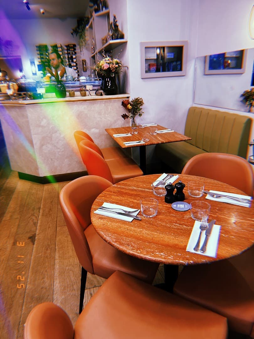 Dining area seating at England's Grace, London