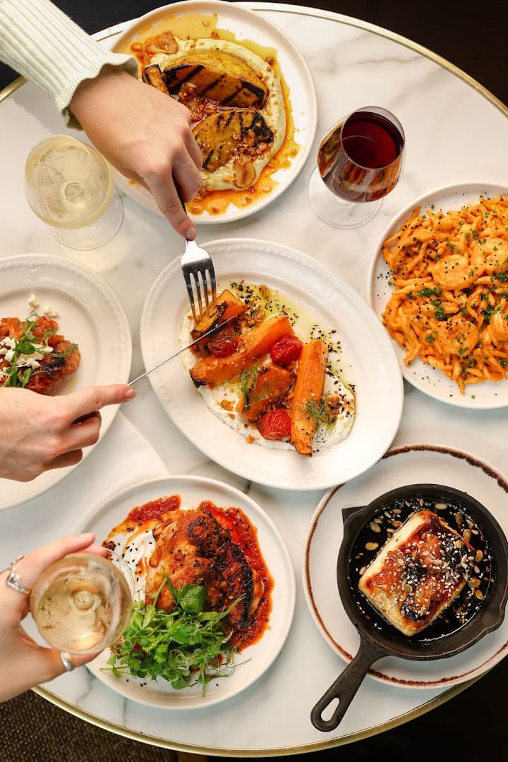 Sharing feast table at Brother Marcus South Kensington, London