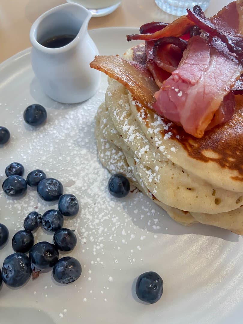 Pancake stack with bacon and blueberries at Where The Pancakes Are, Flat Iron Square, London