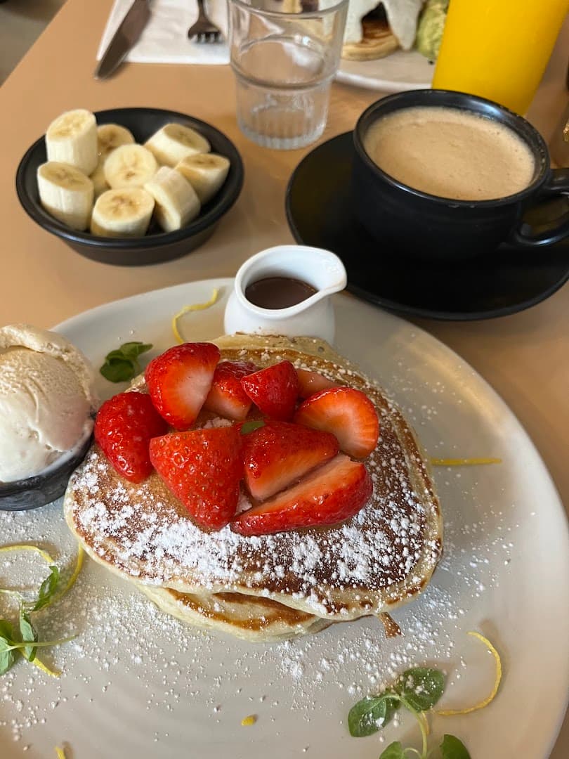 Strawberry pancakes with coffee at Where The Pancakes Are, Flat Iron Square, London