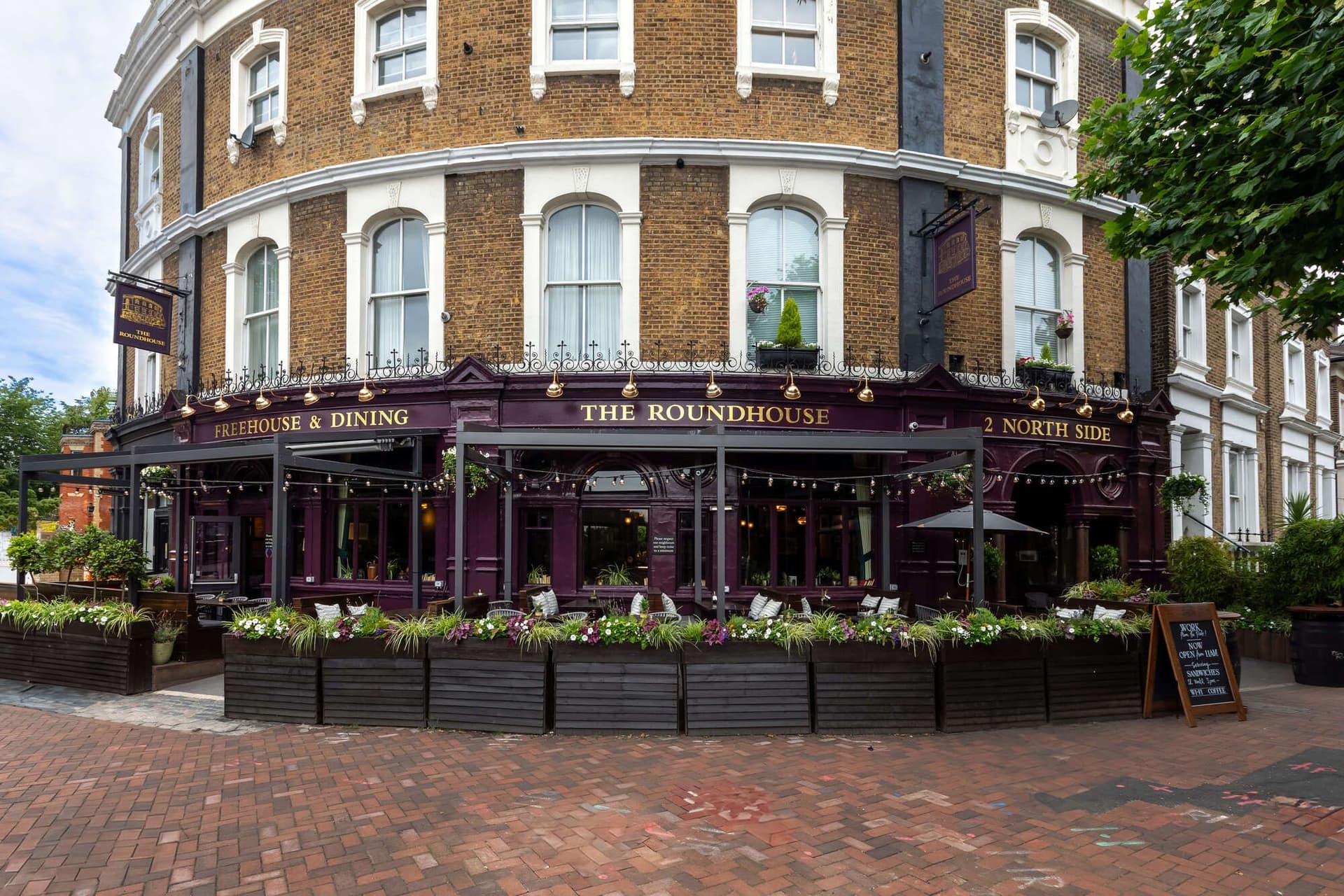 Front facade with outdoor seating at The Roundhouse, London