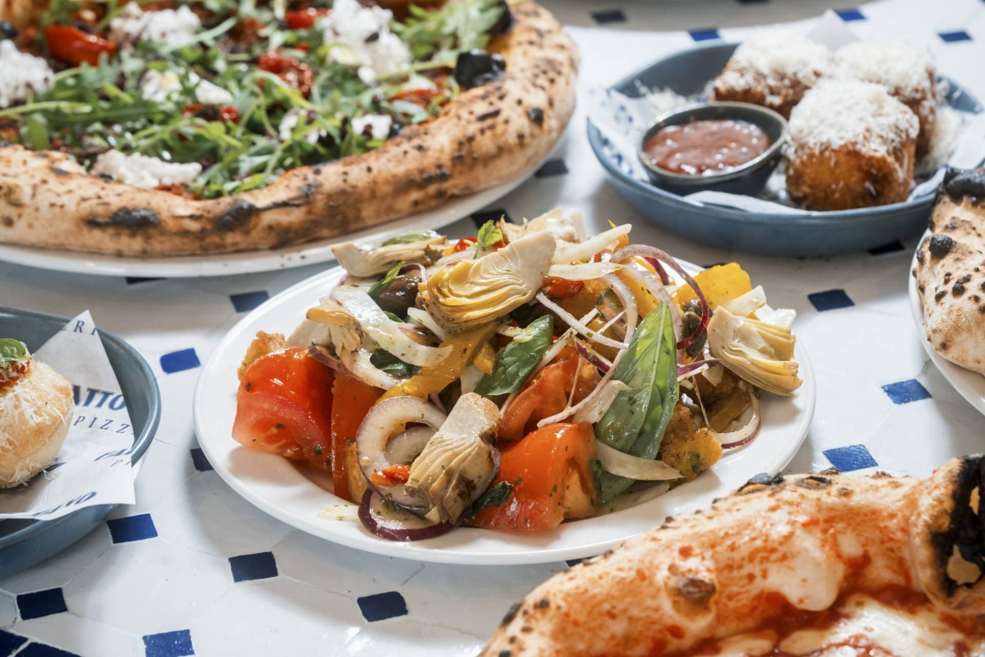 Pizza and antipasti spread at Fatto a Mano Covent Garden, London