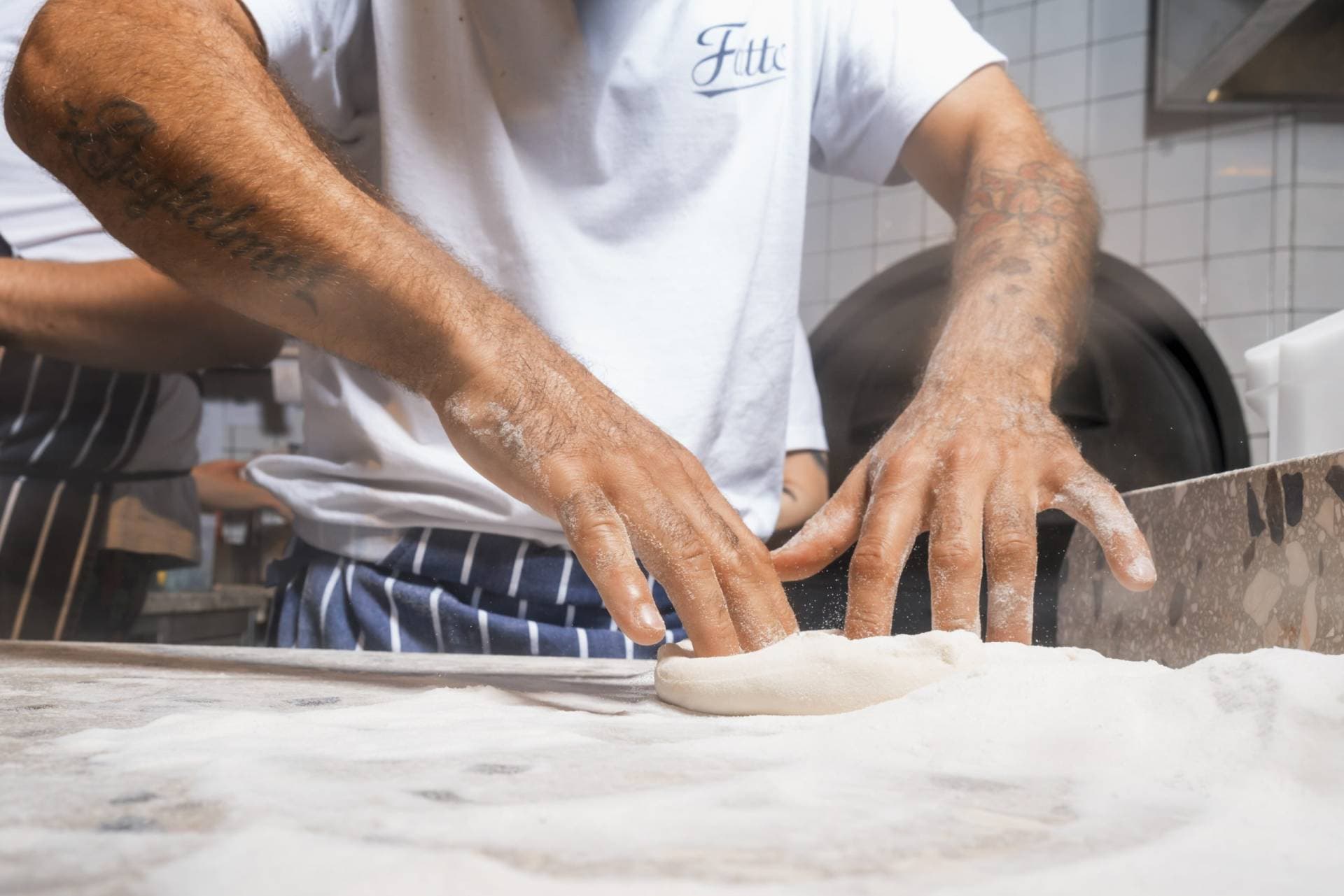 Fresh pizza dough preparation at Fatto a Mano Covent Garden, London