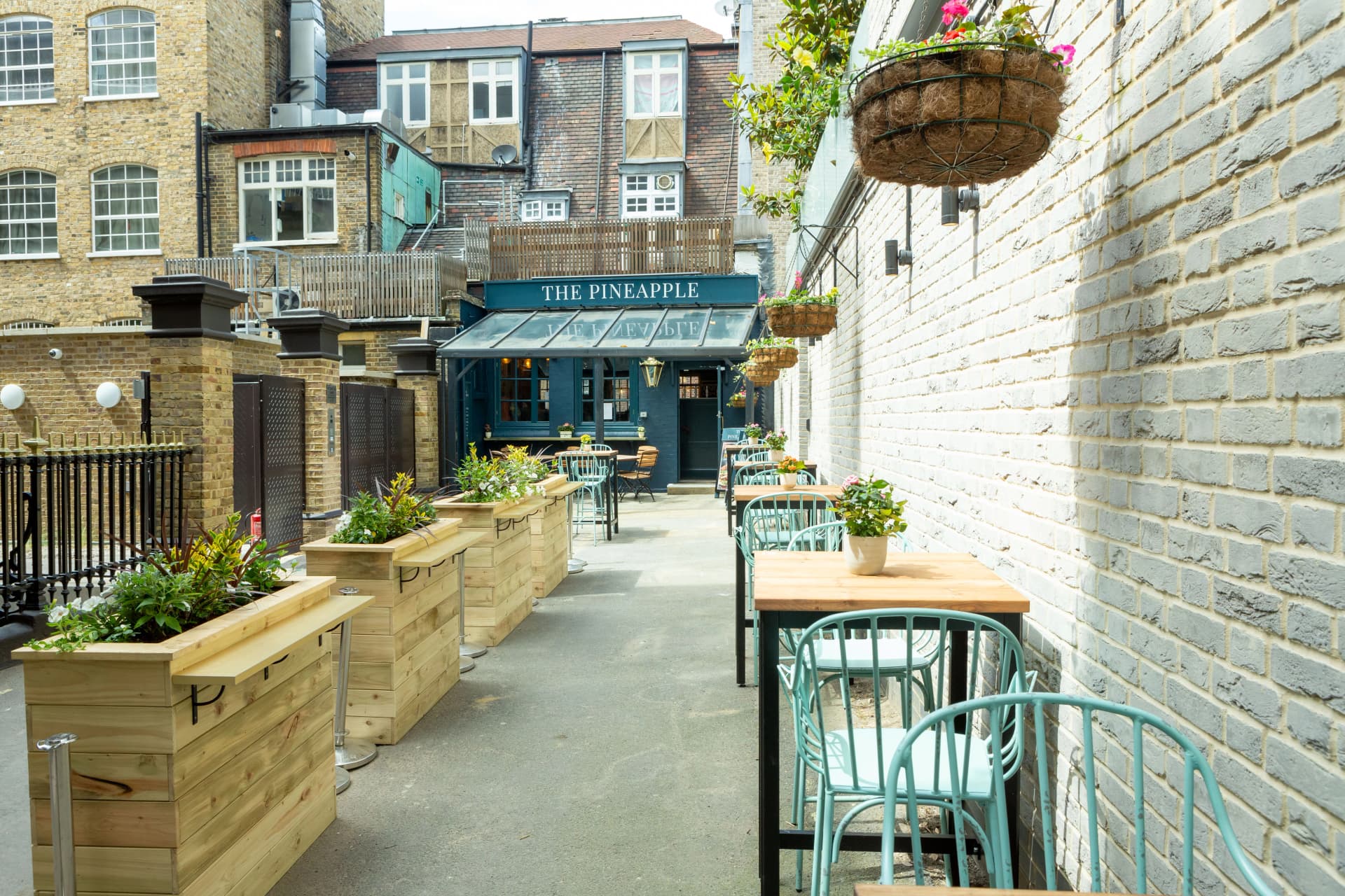 Outdoor terrace seating at The Pineapple, London
