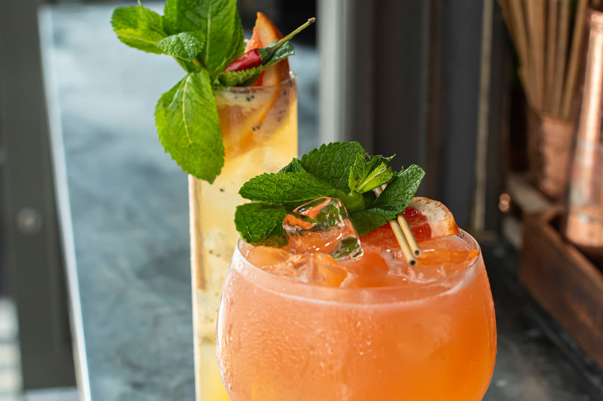 Cocktails with fresh garnish at Foley's, London