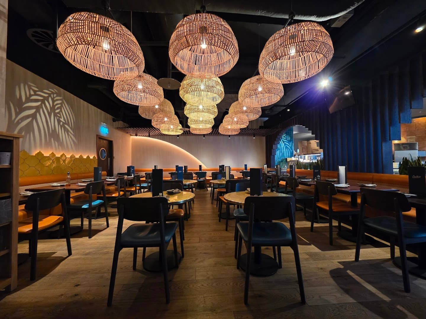 Modern dining room with woven pendant lights at Gallio, London