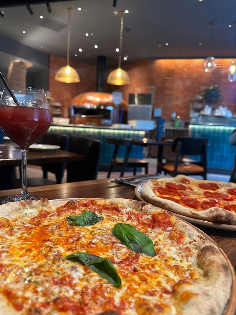 Margherita and pepperoni pizza with wine at Gallio, London