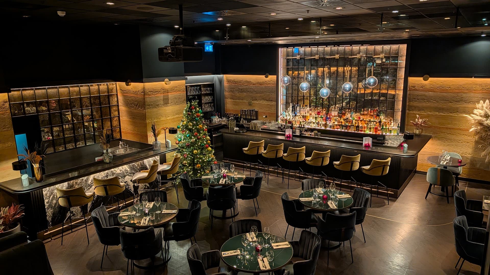 Elegant bar area with festive Christmas décor at Gaucho Charlotte Street, London