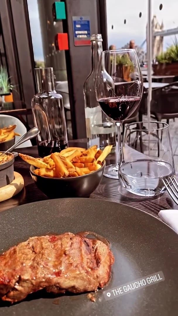Grilled steak with fries and red wine at Gaucho Hampstead, London