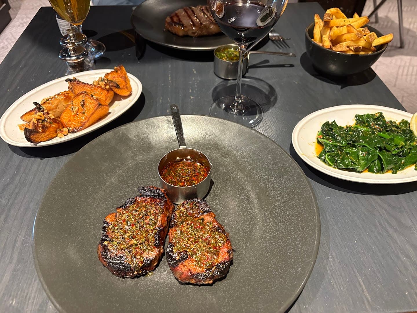 Grilled steaks with sides at Gaucho Hampstead, London