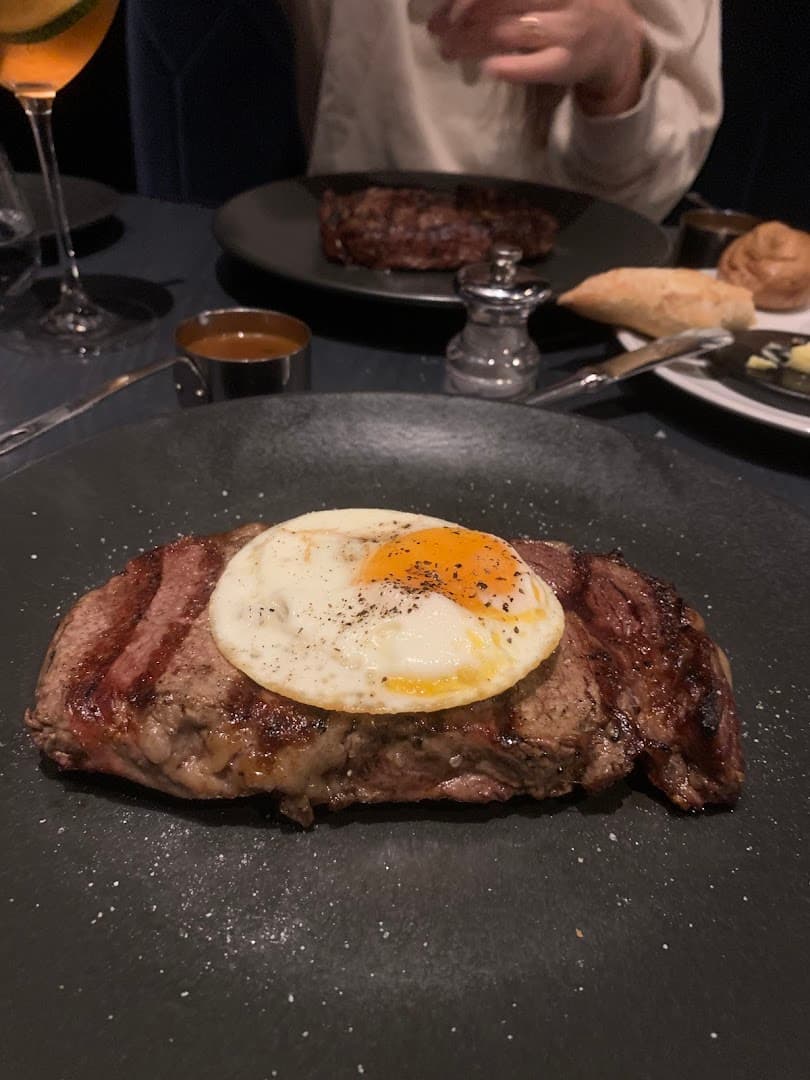 Ribeye steak with fried egg at Gaucho Hampstead, London