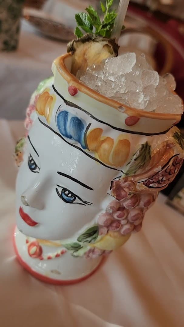 Decorative cocktail in head planter at Jacuzzi, London