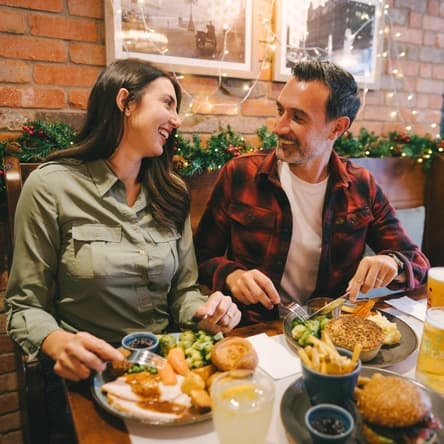 Couples dining with festive Christmas atmosphere at Kings Arms, London