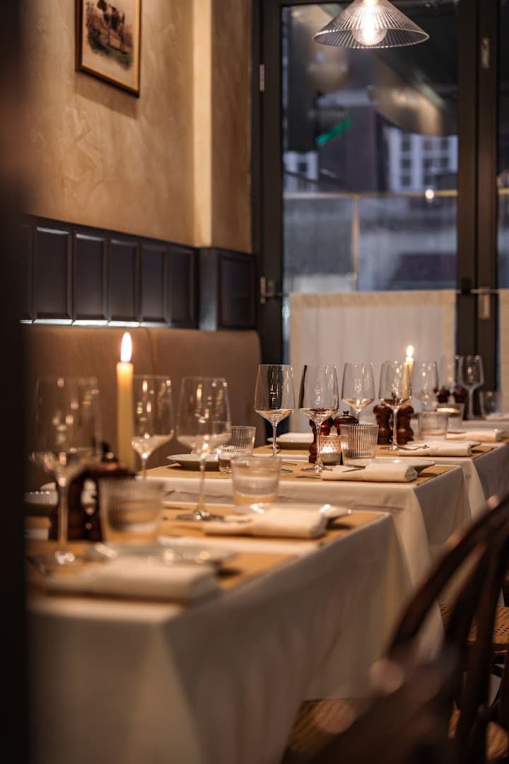 Candlelit table setting at La Palombe Kensington, London