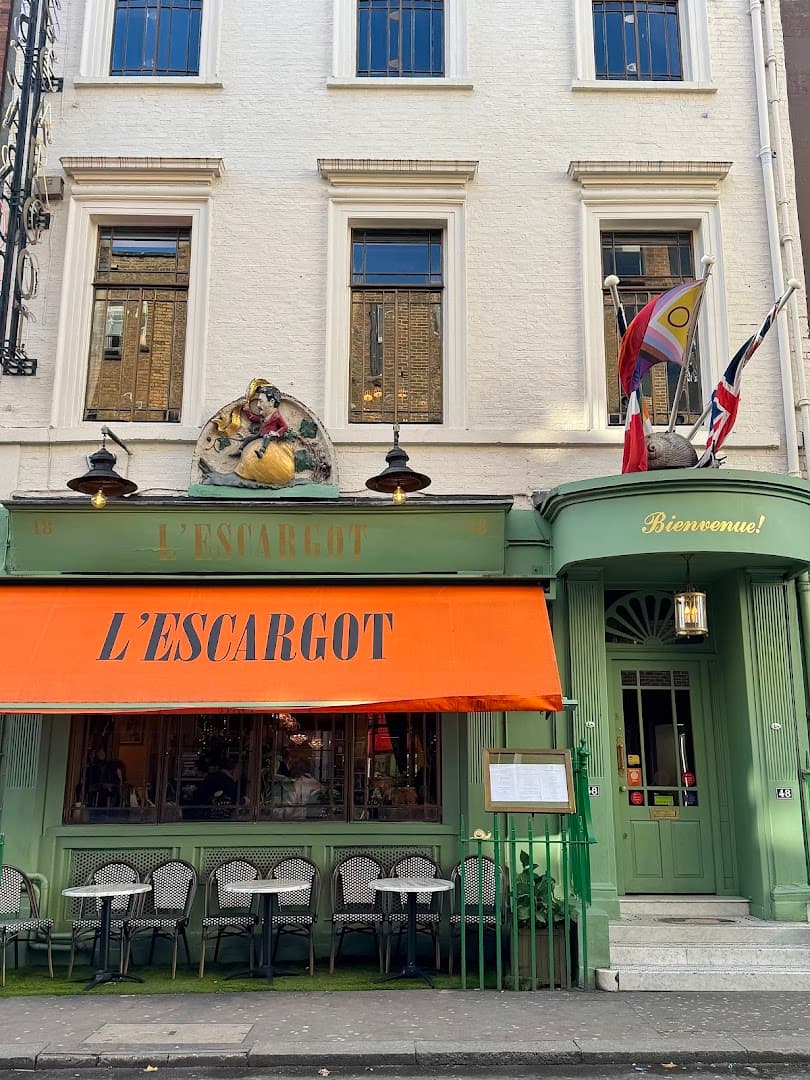 Front facade with outdoor seating at L'Escargot Restaurant, London