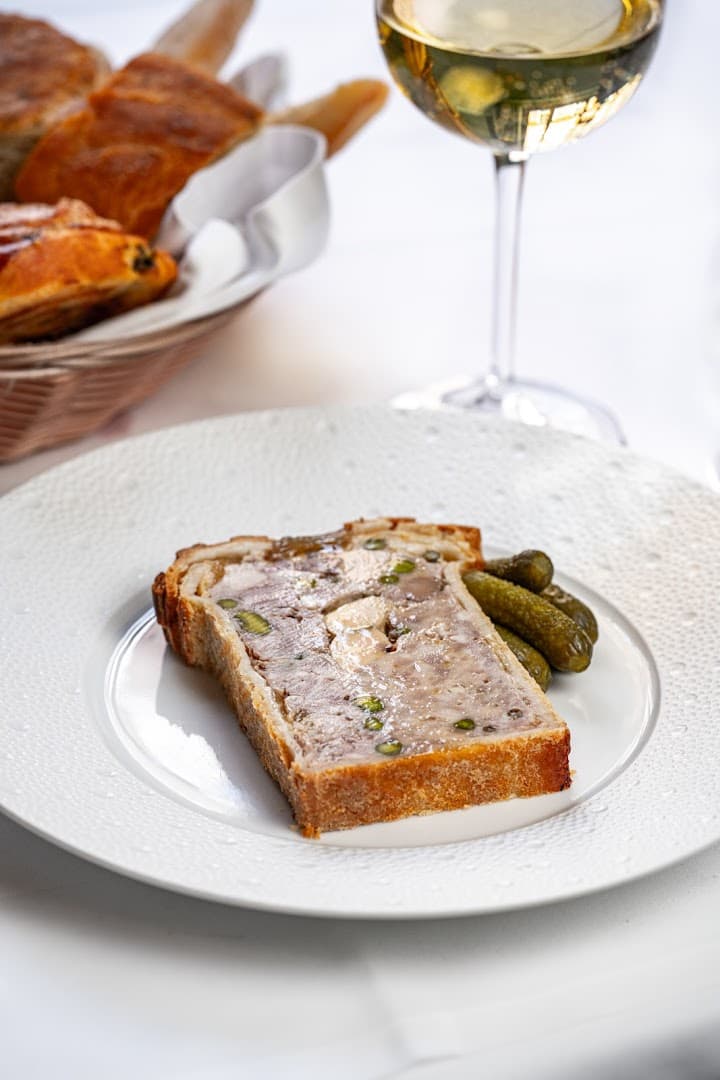Pâté en croûte with cornichons and white wine at L'Escargot Restaurant, London