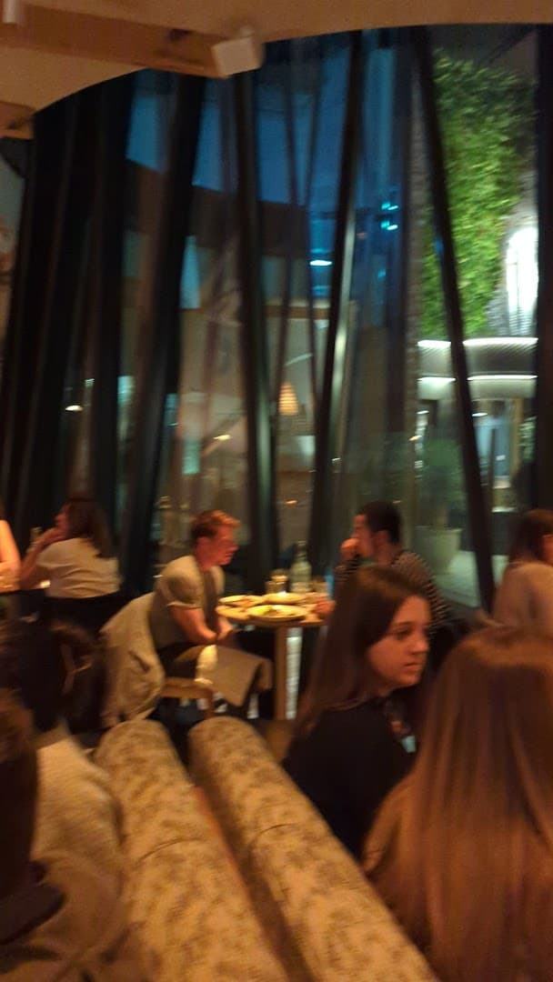 Dining area with window seating at Milk Beach Soho, London