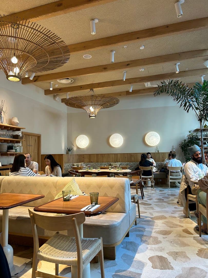 Modern coastal-inspired dining room at Milk Beach Soho, London