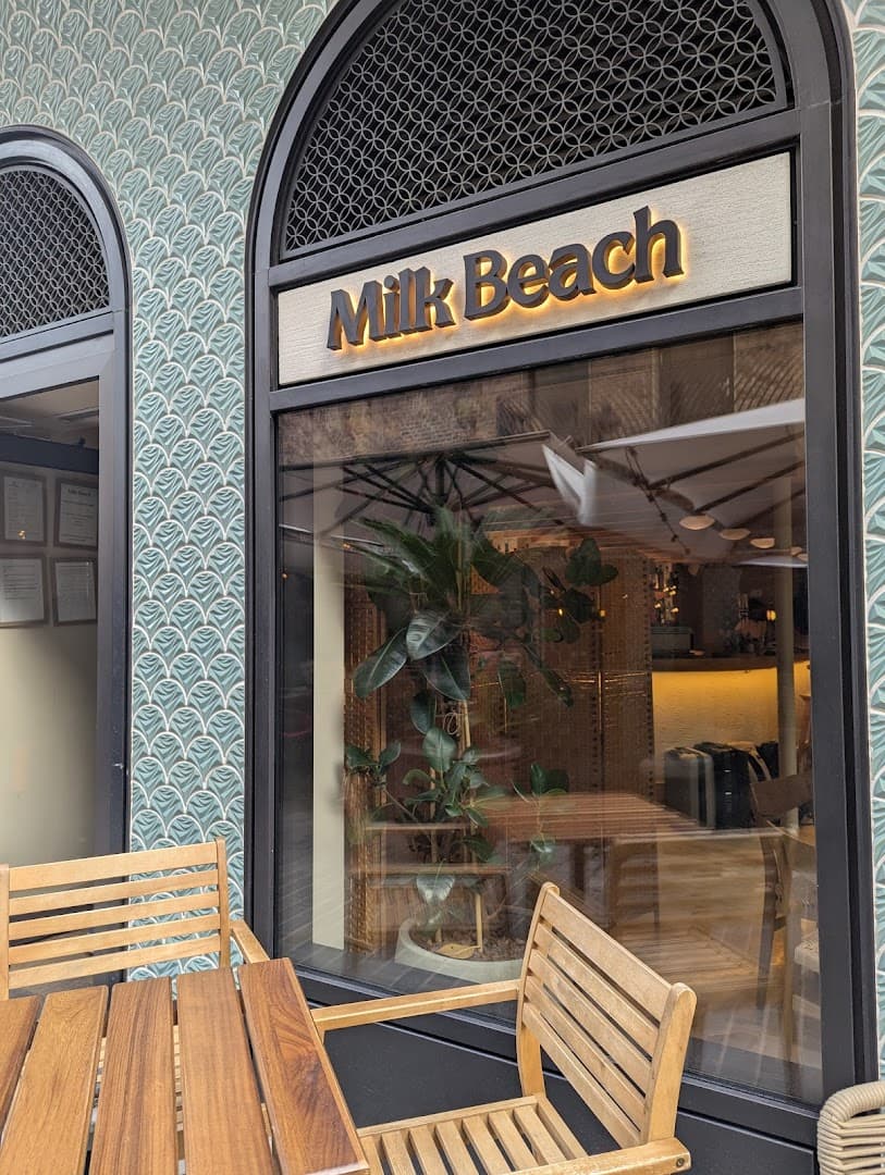 Front entrance with outdoor seating at Milk Beach Soho, London