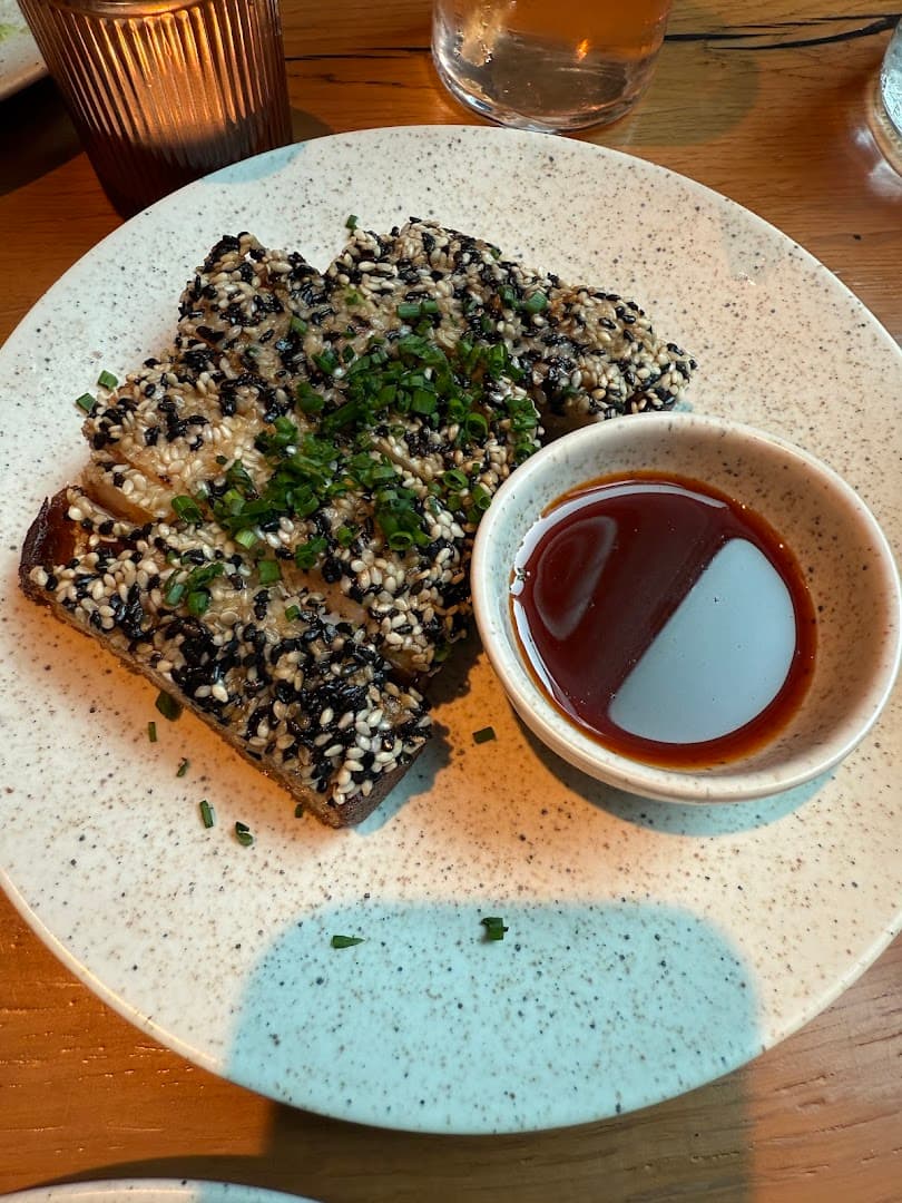 Sesame-crusted prawn toast at Milk Beach Soho, London