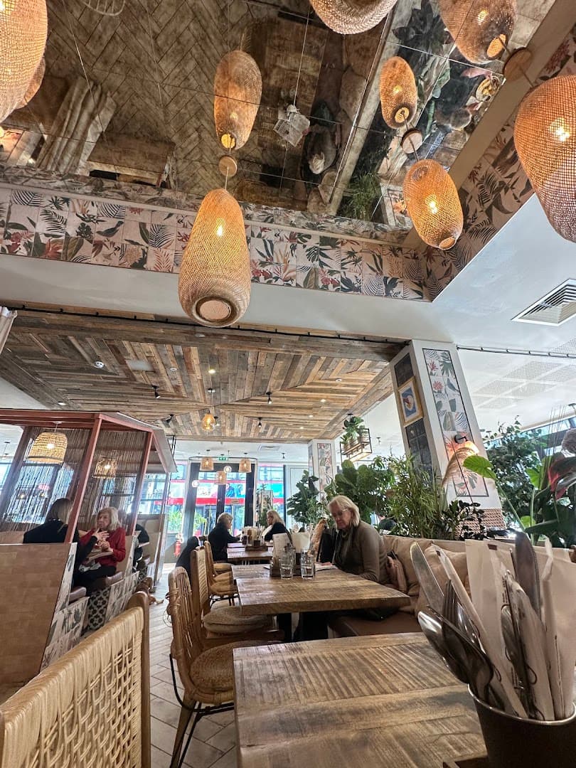 Tropical-themed dining room at Ollie's House Restaurant, Chelsea, London