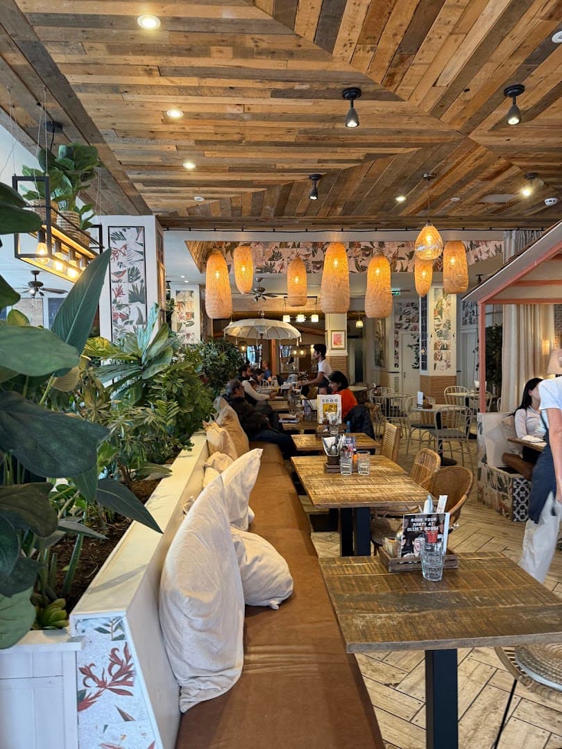 Tropical-inspired dining room at Ollie's House Restaurant, Chelsea, London