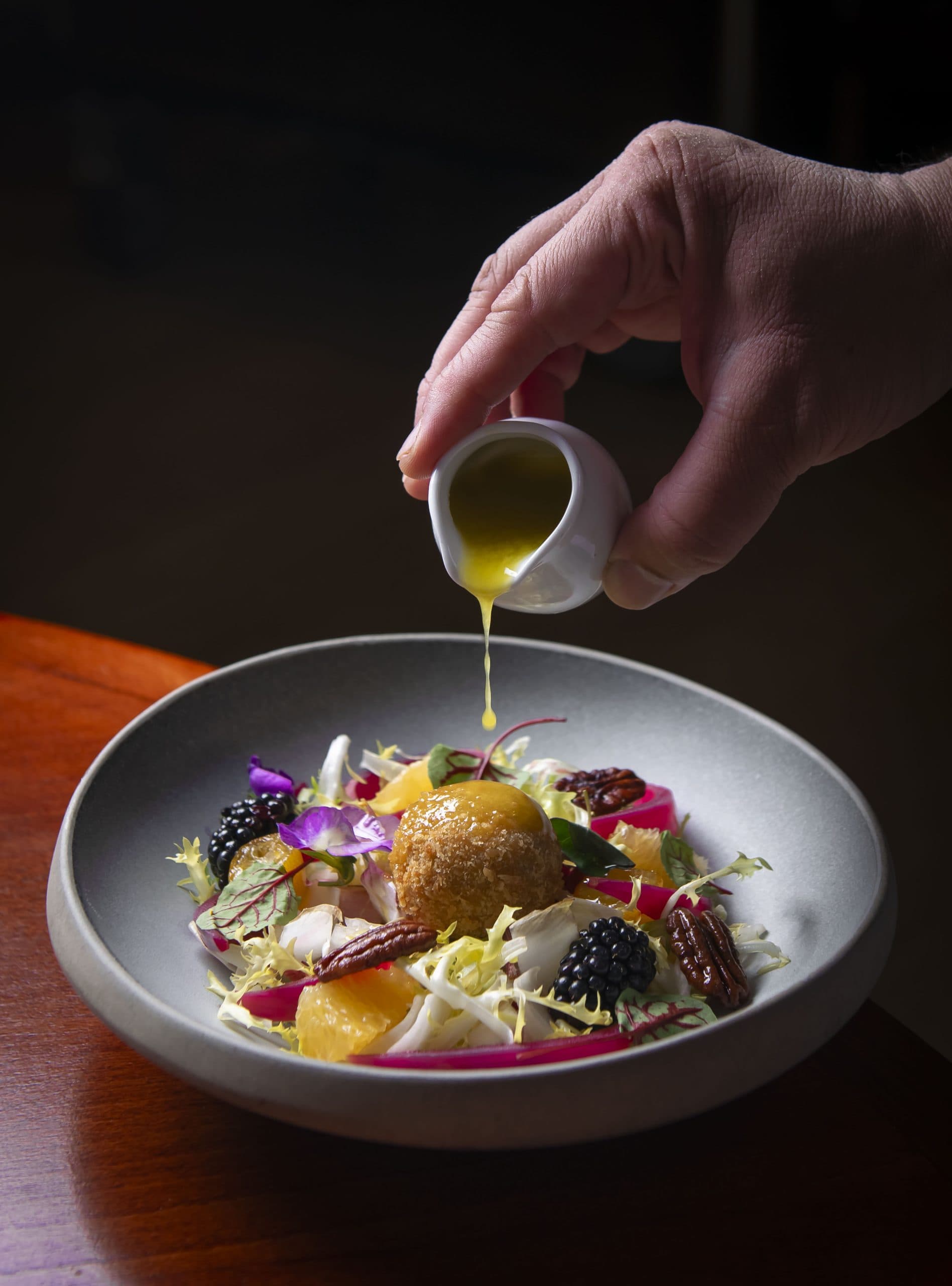 Plated salad with dressing at Restaurant 45 St Martins Lane, London