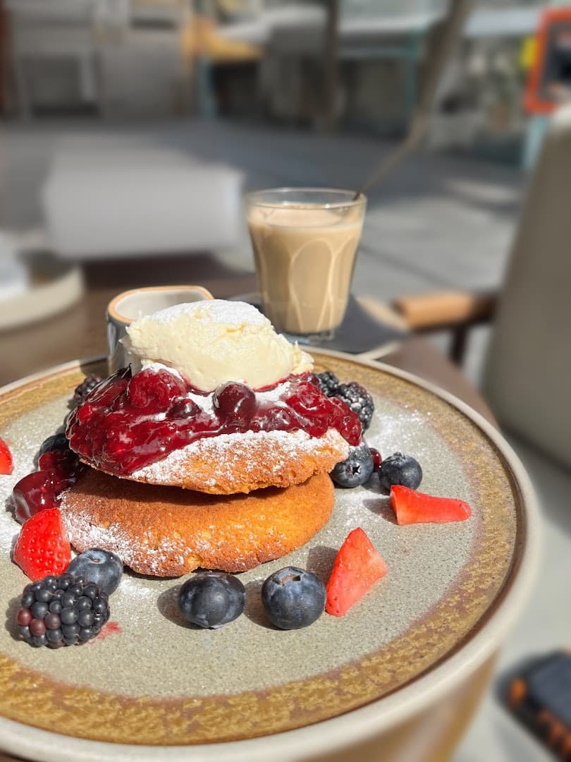Fluffy pancakes with berries at Riding House Bloomsbury, London