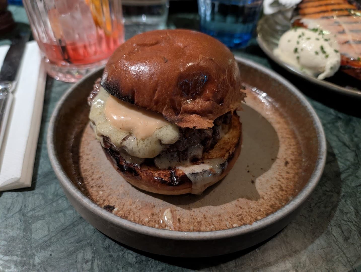 Gourmet cheeseburger at Riding House Bloomsbury, London