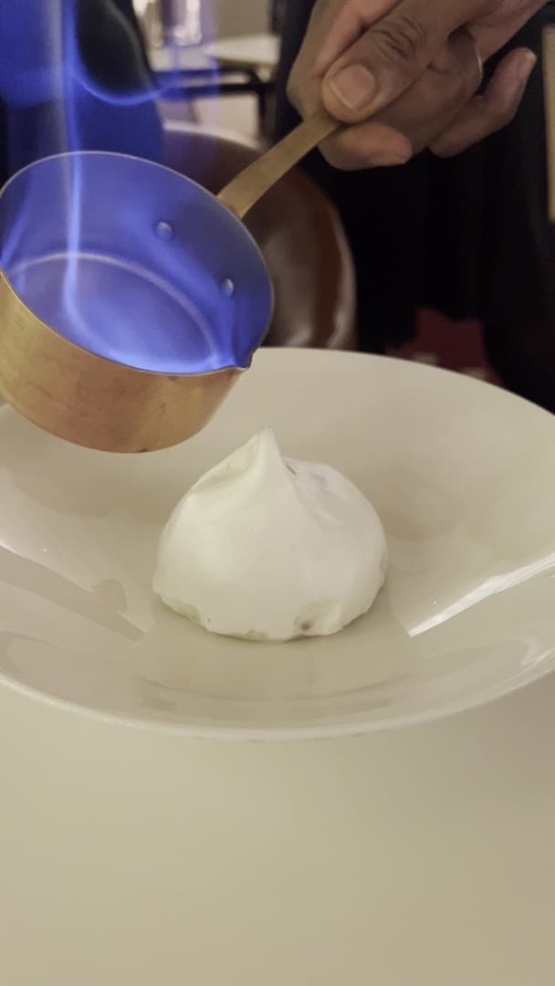 Flambéed dessert service at Rotunda Bar & Lounge, London