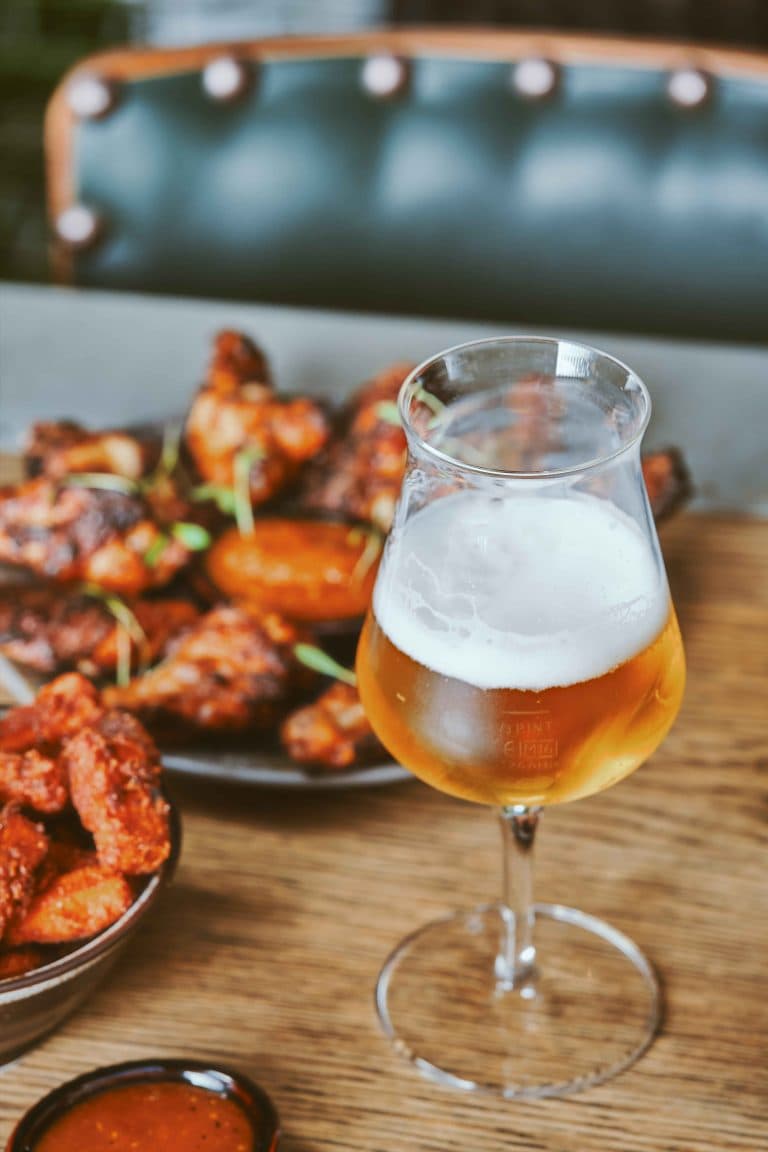 Chicken wings and craft beer at The Black Lion Pub & Boutique Guesthouse, London