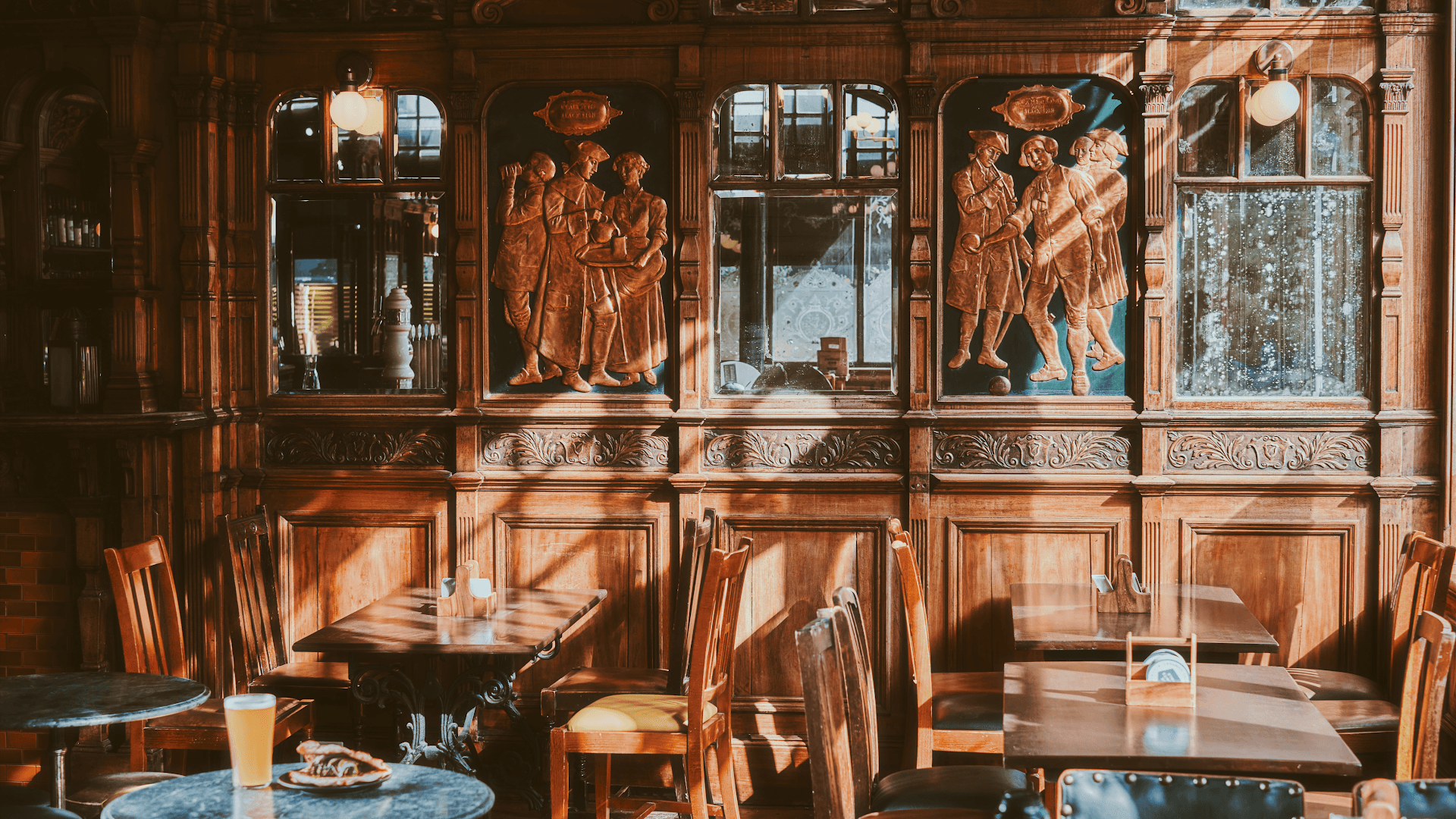 Ornate wooden bar area at The Black Lion Pub & Boutique Guesthouse, London