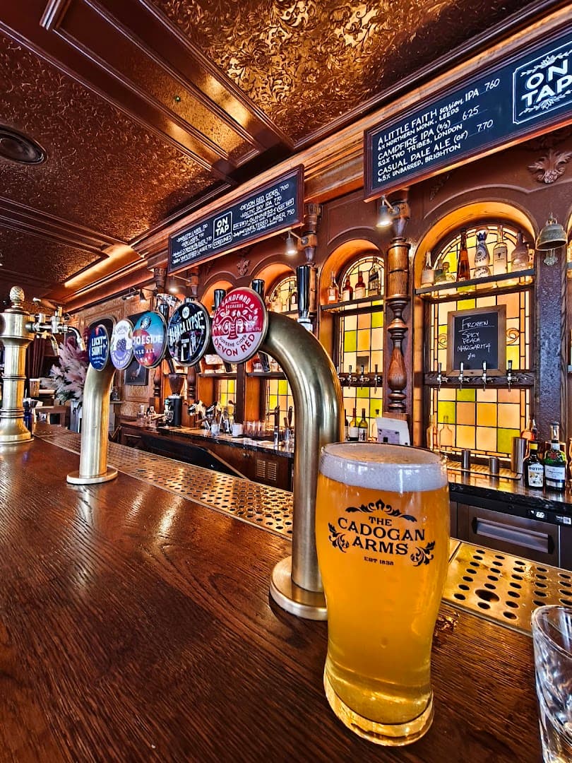 Traditional bar area with beer taps at The Cadogan Arms, London
